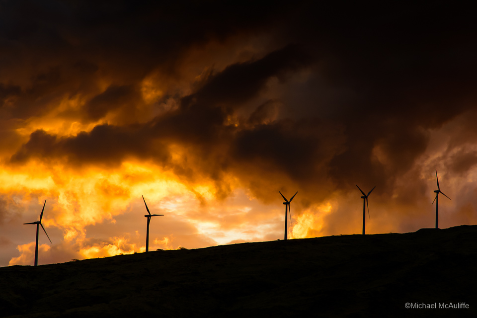 Windmills on Maui, Hawaii, at sunset.