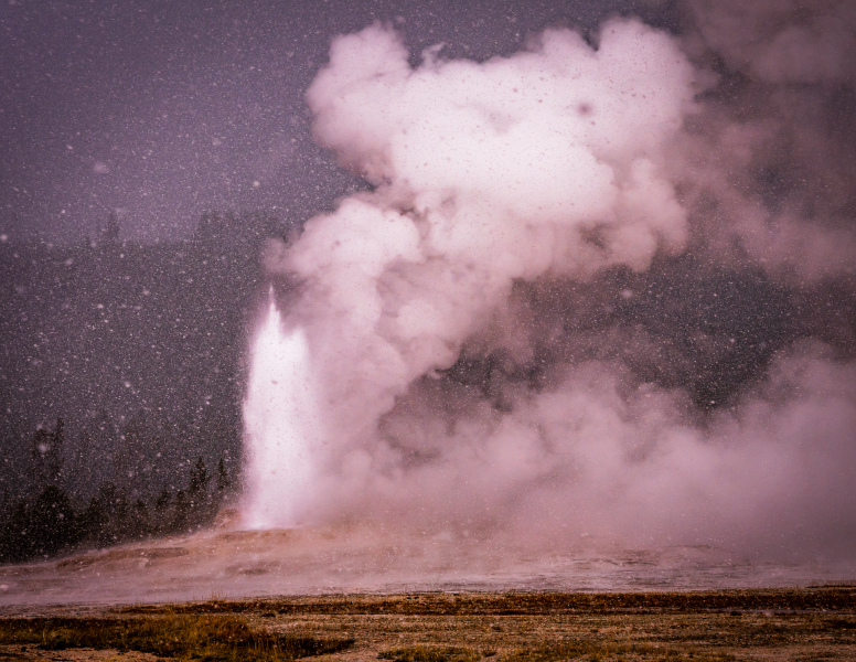 Old Faithful Eruption in the Snow