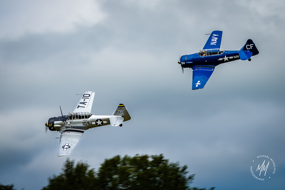 North American AT-6 Texans flying in formation at the Heritage Flight Museum in Burlington, Washington. Photograph by Michael McAuliffe.