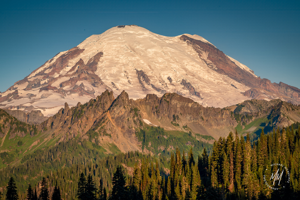 A photograph of Mount Rainier taken from Tipsoo Lake on the east side of Mount Rainier National Park.