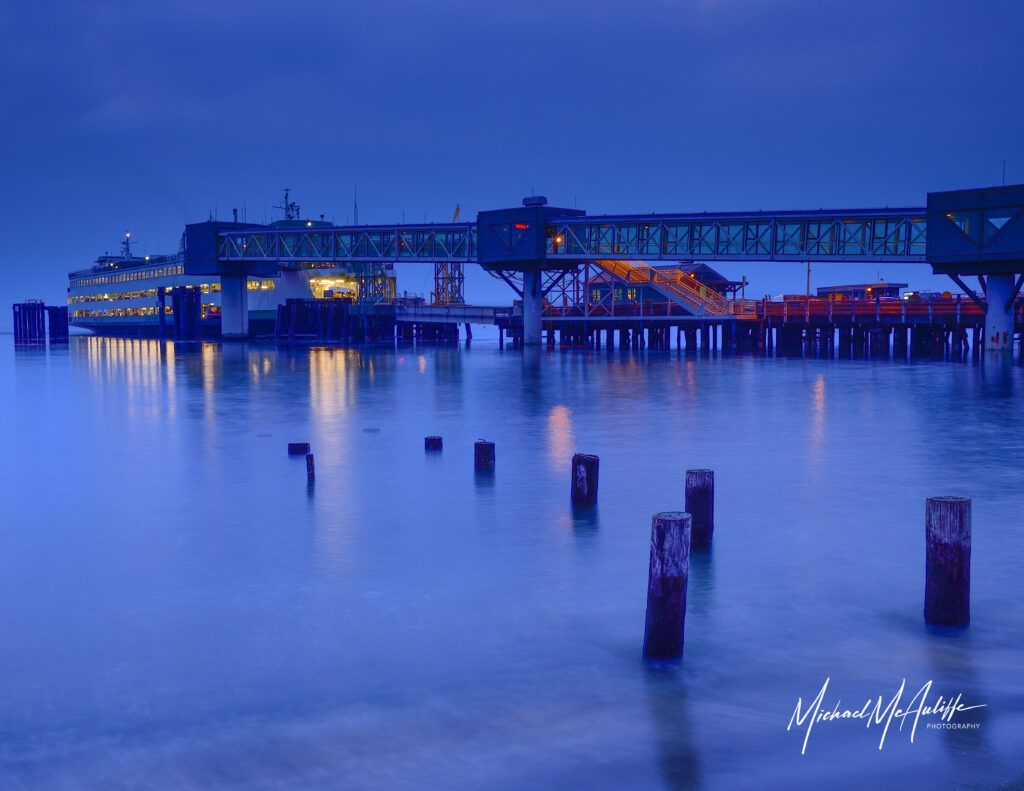 A Washington State Ferries' ferry boat at the dock in Edmonds, Washington, during the blue hour after sunset. Photograph by Michael McAuliffe.